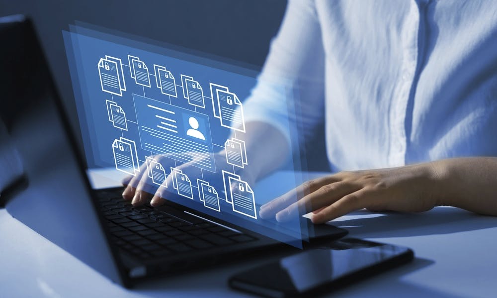 conceptual image of person using laptop with employee confidentiality. Software for security, searching and managing corporate files and employee information