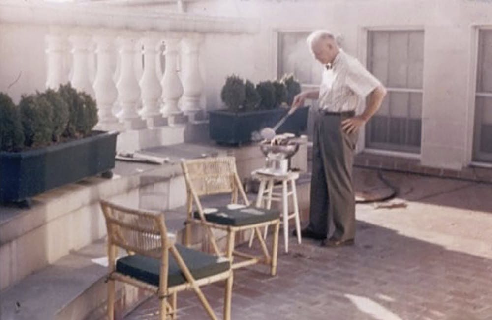 President Eisenhower cooking quail in the White House solarium.