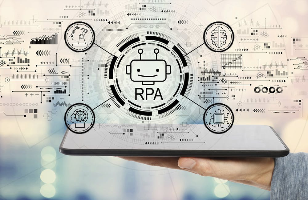Robotic process automation concept with man holding a tablet computer