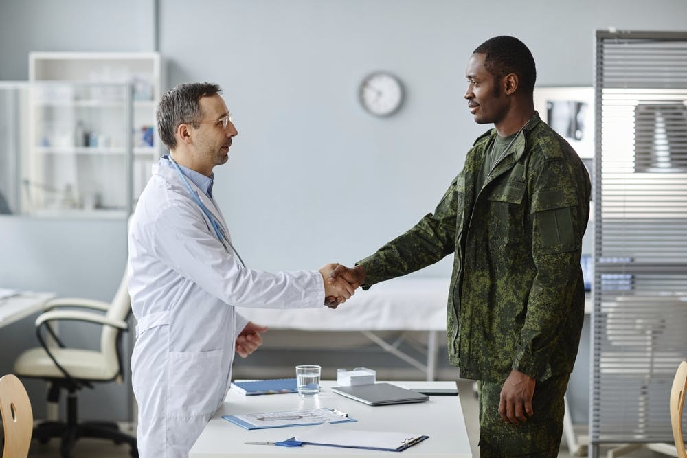greeting each other with handshake at appointment in hospital