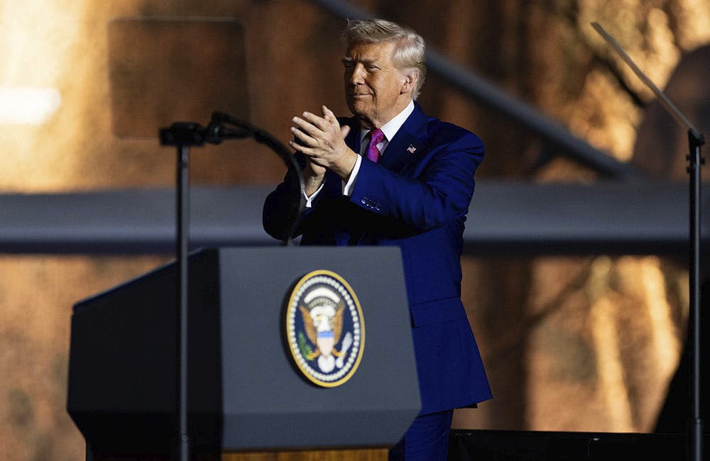 President Donald Trump addresses service members at Al Udeid Air Base, Qatar on May 15, 2025.