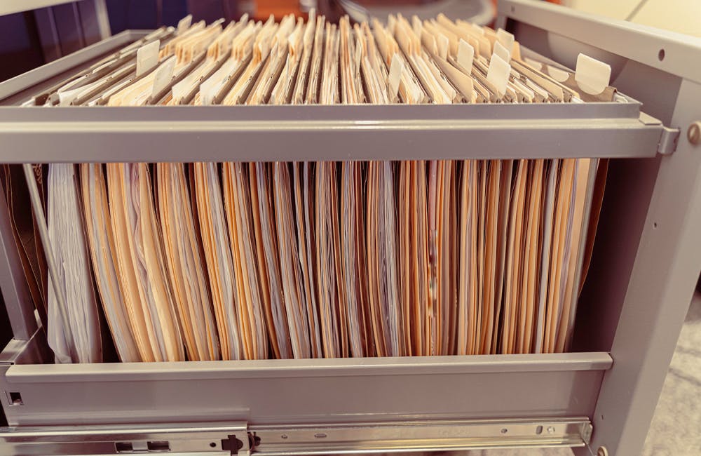 files in cabinet representing digitization, data modernization