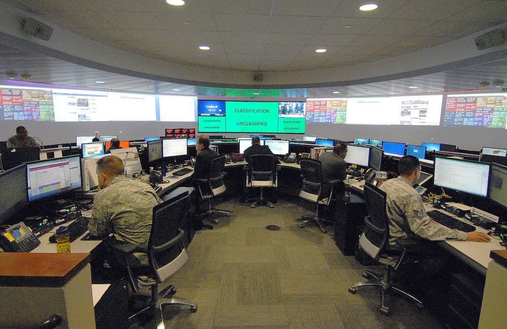 Working at agency computer terminals; command center at Fort Meade, MD