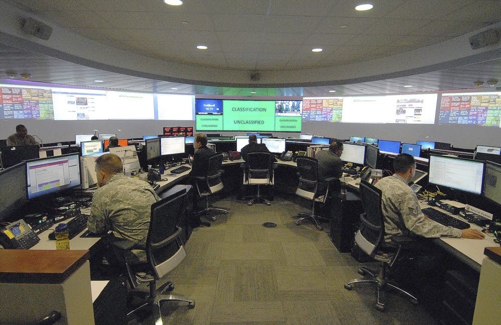 Working at agency computer terminals; command center at Fort Meade, MD