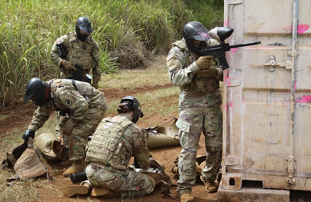 image of Hawaii Army National Guard and U.S. Army Garrison combat medics stationed in Hawaii, provide suppressive fire as they treat and prepare to tactically transport simulated casualties to safer areas, at the Medical Simulation Training Center, Schofield Barracks, Hawaii, June 13, 2022.