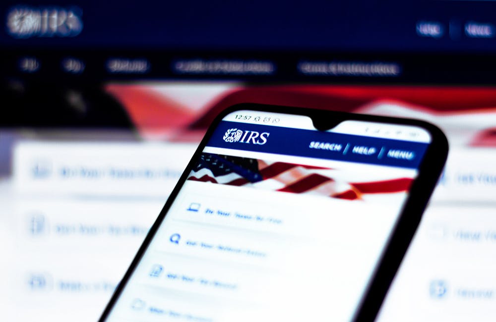 In this photo illustration the Internal Revenue Service (IRS) website seen displayed on a smartphone. Selective focus.