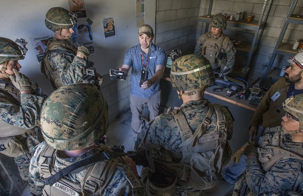 image of U.S. Marines with 3rd Battalion, 4th Marine Regiment, 1st Marine Division listen to a brief about a communication system during Urban Advanced Naval Technology Exercise 2018 (ANTX18) at Marine Corps Base Camp Pendleton, California, March 15, 2019.