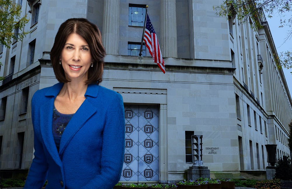image of Nancy La Vigne, Director, Nation Institute of Justince in front of the department of justice building in Washington D.C.