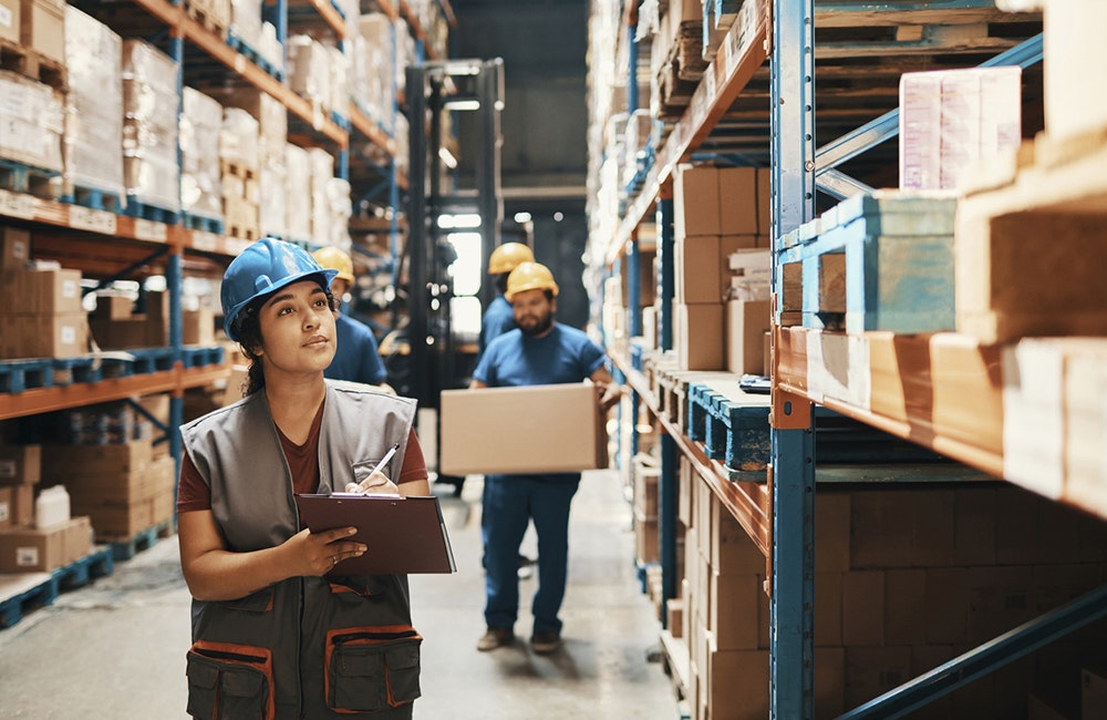 Close up of a group of workers working in a warehouse