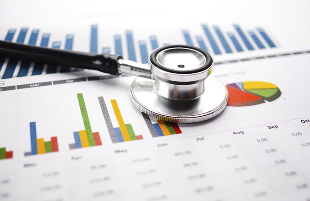 Stethoscope, Charts and Graphs spreadsheet paper, Finance, Account, Statistics, Investment, Analytic research data economy spreadsheet and Business company concept.