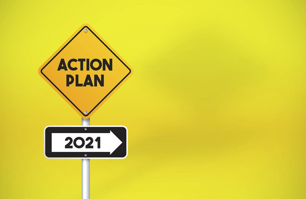 Action Plan 2021 Directional Road Sign On Yellow Background. Horizontal composition with copy space.