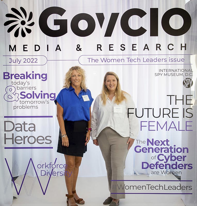 Attendees pose with our Women Tech Leaders magazine cover.