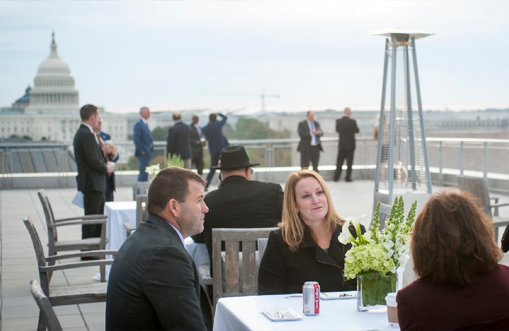Attendees enjoy the rooftop ambiance.