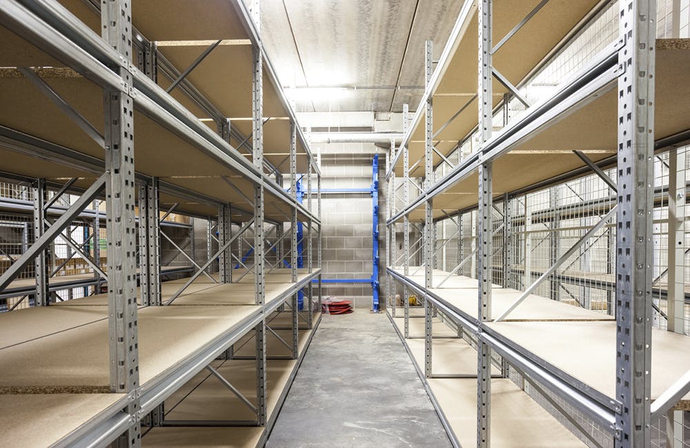 empty storage racks in a building with security