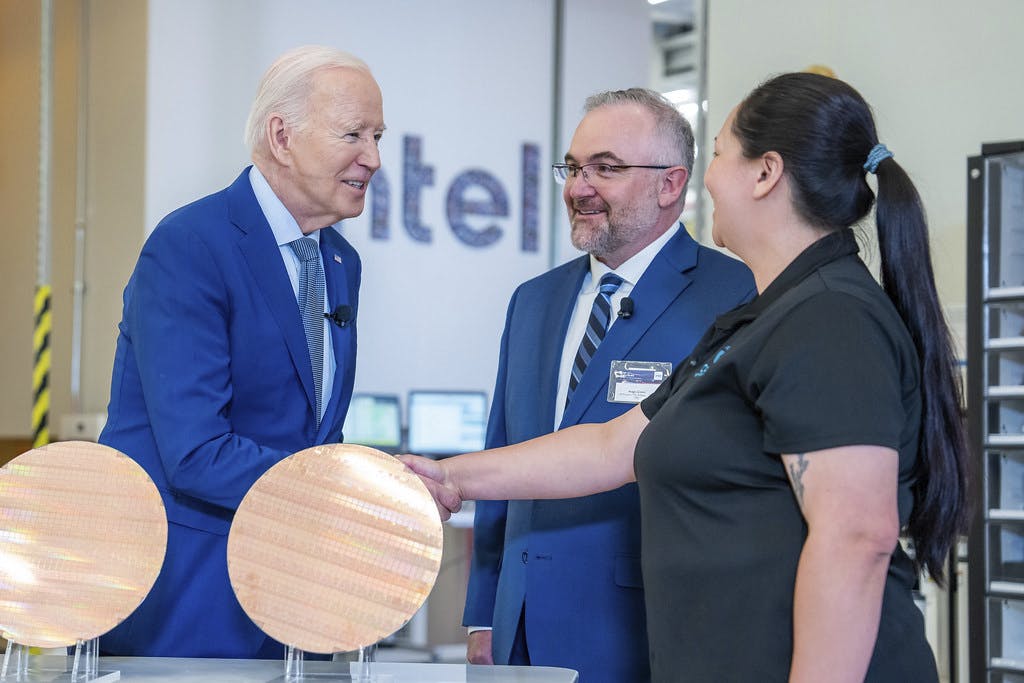 President Joe Biden shakes hands with technician Michelle Blackwell during a tour of the Intel Ocotillo Campus, Wednesday, March 20, 2024, in Chandler, Arizona.