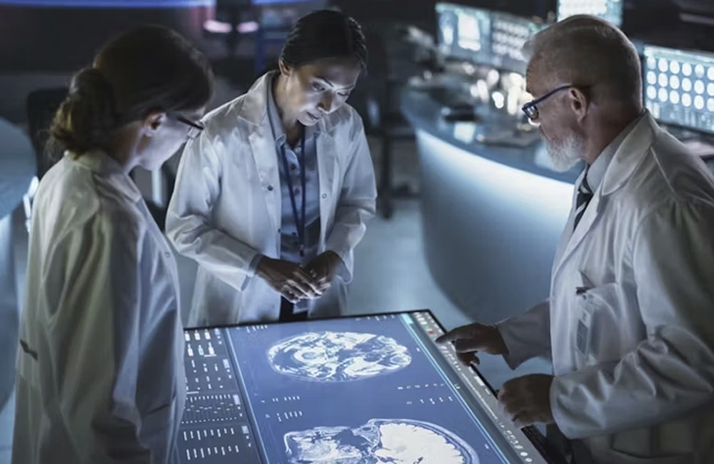 Health practitioners look at a digital screen
