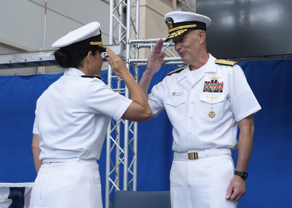 Rear Adm. Seiko Okano, left, relieves Rear Adm. Doug Small as commander, Naval Information Warfare Systems Command during a change of command ceremony on Aug. 9.