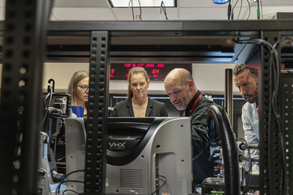 workers look at a computer