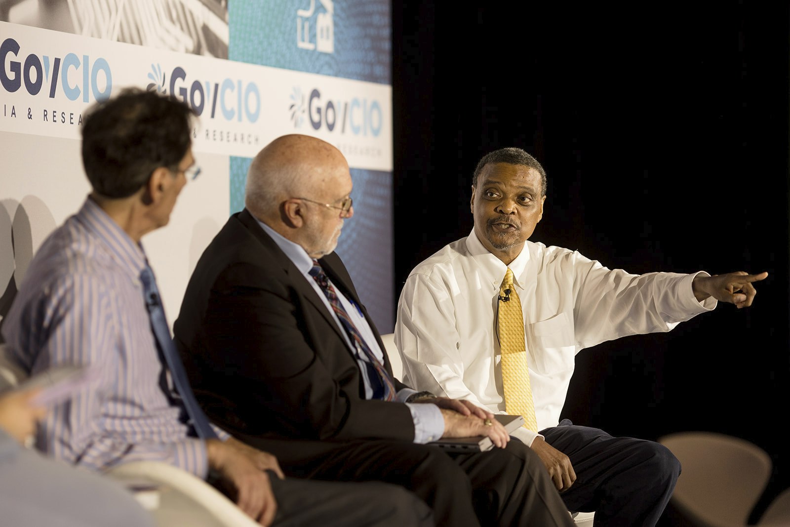 USDA's Rudolf Rojas, HP Federal's Tommy Gardner and NAVSEA's Garry Shields speak at the GovCIO Media & Research AI Summit in Tysons Corner, Virginia, on Nov. 7, 2024.