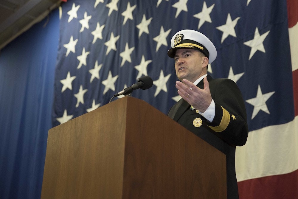 (March 9, 2018) Then-Rear Adm. John B. "Brad" Skillman speaks during a change of command ceremony in which Skillman relieved Rear Adm. Jeff Hughes as Commander, Expeditionary Strike Group 2, in the hangar bay of the amphibious assault ship USS Kearsarge (LHD 3).