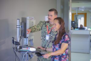 Clinicians operate a computer