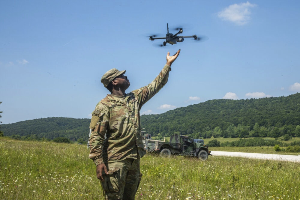 A U.S. soldier assigned to 3rd Squadron, 2nd Cavalry Regiment reaches for a unmanned aerial system during Project Flytrap at Joint Multinational Readiness Center, Hohenfels Training Area, Hohenfels, Germany, June 19, 2025.