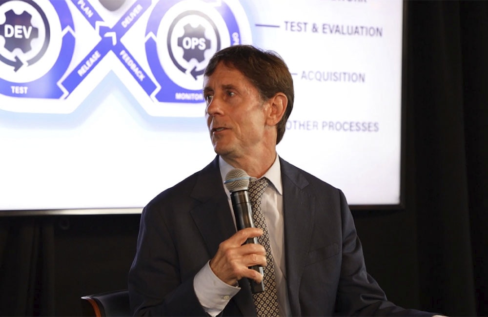 DOD Information Networks Capabilities, Information Enterprise Director George Lamb speaks during the 2025 Carahsoft DevSecOps Conference in Reston, Virginia, on July 29, 2025.