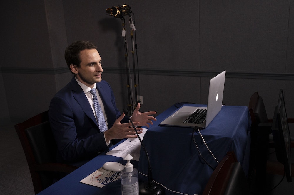 White House OSTP Director Michael Kratsios talking through a laptop.