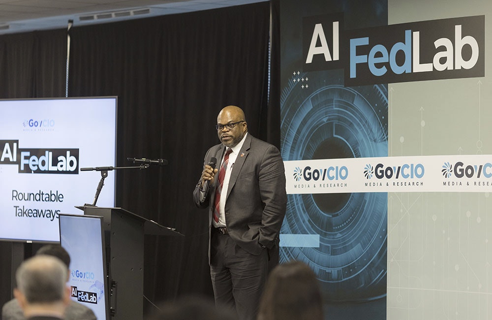 Marine Corps Service Data Officer Deputy and Department of the Navy Chief Data Officer Colin Crosby speaks at GovCIO Media & Research's AI FedLab in Reston, Virginia, on May 13, 2025.