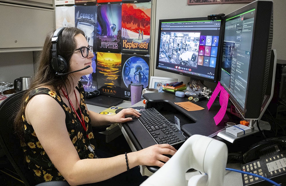 Samantha Chapin, U.S. Naval Research Laboratory (NRL) space roboticist, performs a reinforcement learning control test on free-flyer robots aboard the International Space Station from NRL headquarters in Washington, D.C., May 27, 2025.