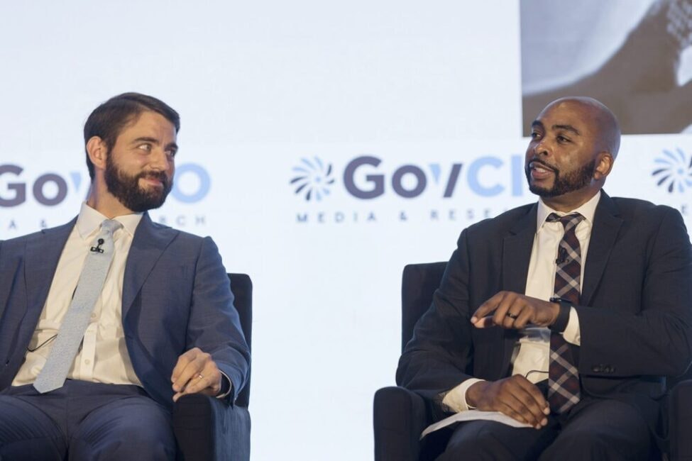 Patrick Newbold, CIO and OIT Director at CMS, and John Giannini, health science policy analyst at All of Us, NIH, speak at the 2025 Health IT Summit in Rockville, Maryland, on Sept. 23, 2025.