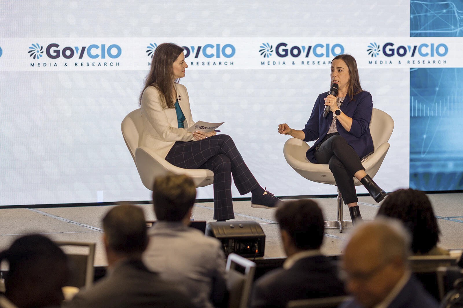 Two speakers on stage at the 2026 Health IT Summit in Bethesda, Maryland