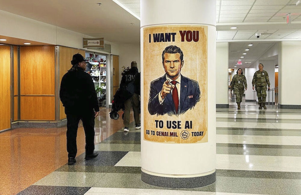 Employees walk past a GenAI.mil poster at the Pentagon on Dec. 12, 2025.