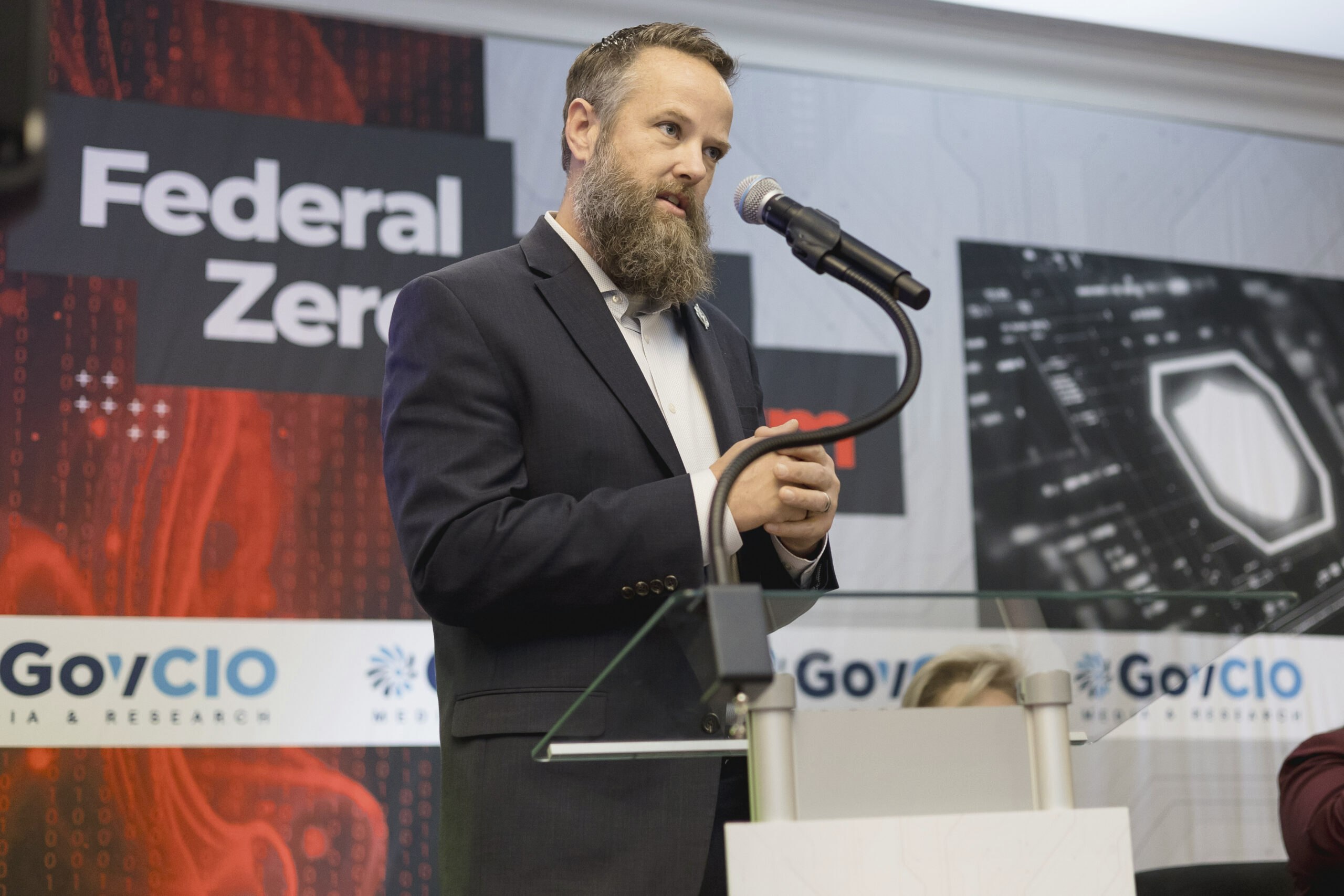 Marine Corps Community Services (MCCS) Chief Digital Business Officer Dave Raley speaks at at GovCIO Media & Research's Zero Trust Forum in Arlington, Virginia, on Dec. 16, 2025.