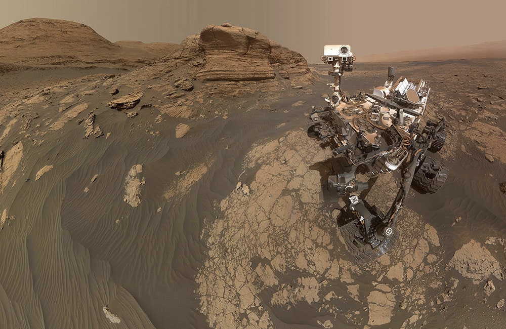 NASA’s Curiosity Mars rover used two cameras to create this selfie in front of Mont Mercou, a rock outcrop that stands 20 feet tall.