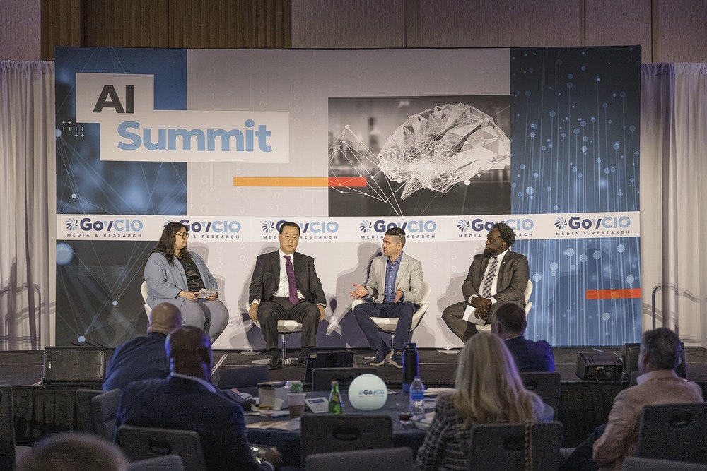 CISA CIO Bob Costello and DLA CIO Adarryl Roberts discuss AI workforce training at GovCIO Media & Research's AI Summit.