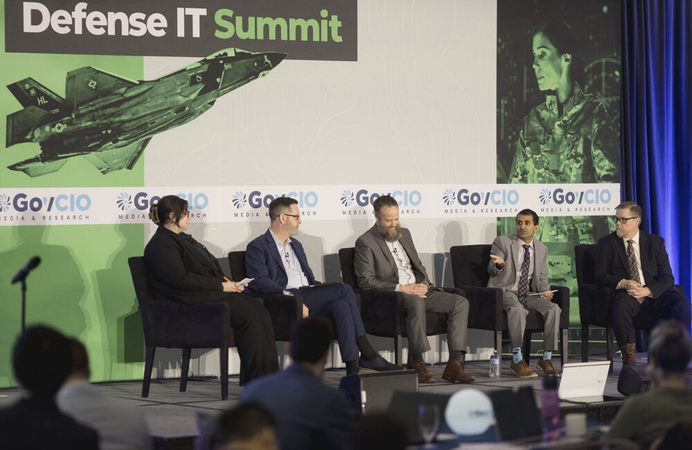 Cohesity's Marlin McFate, Marine Corps Community Services' Dave Raley, Navy Installations Command's Shery Thomas and Defense Health Management Systems' Chris Wallace speak at GovCIO Media & Research's Defense IT Summit on Feb. 26, 2026, in Arlington, Virginia.
