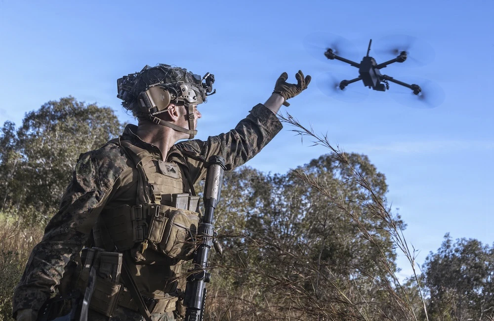 Cpl. Calvin Burke, an intelligence specialist with the 31st Marine Expeditionary Unit, activates a Skydio X2 small unmanned aerial system to survey the defensive line for opposing forces during a simulated assault and seizure at Glen Airfield, Queensland, Australia, July 2025.