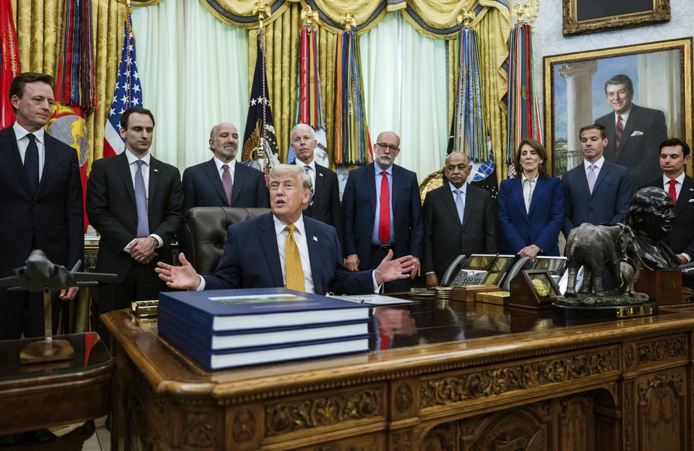 President Donald J. Trump, joined by Secretary of War Pete Hegseth, Physicist John M. Martinis, Science and Technology Policy Director Michael Kratsios, Secretary of Commerce Howard Lutnick, Secretary of Energy Chris Wright, OMB Director Russ Vought, and others, delivers remarks after signing an Executive Order on quantum computing in the Oval Office, Monday, June 22, 2026