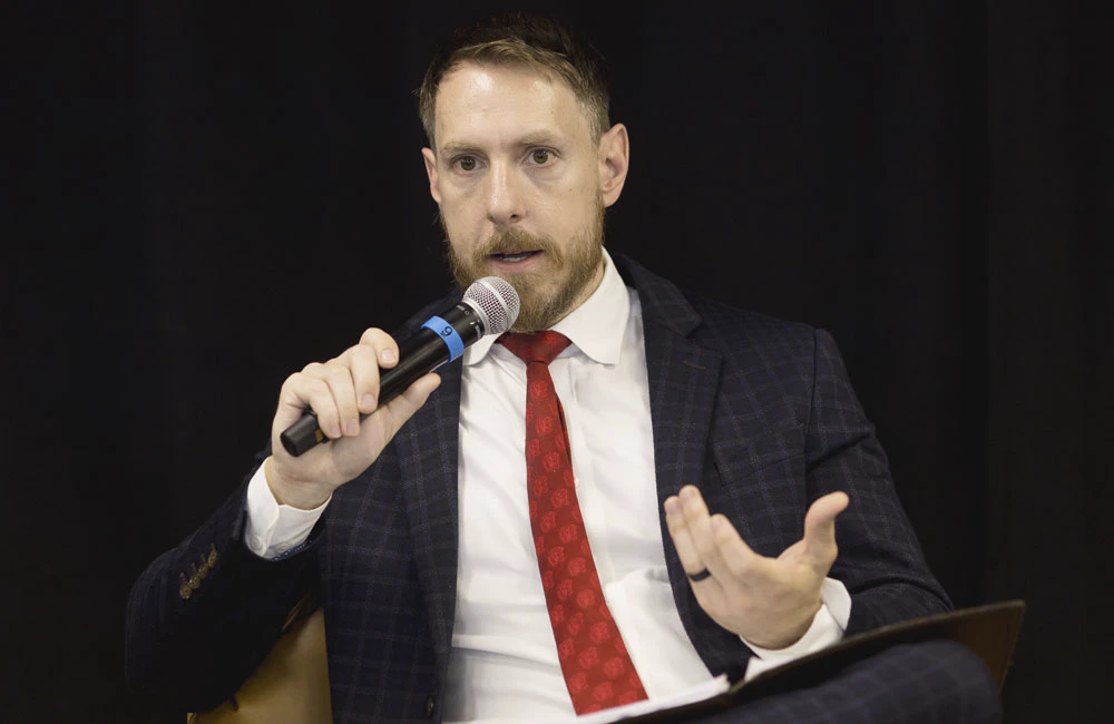 Department of the Navy CTO Justin Fanelli speaks during the Carahsoft DevSecOps Summit July 28, 2026, in Reston, Virginia.