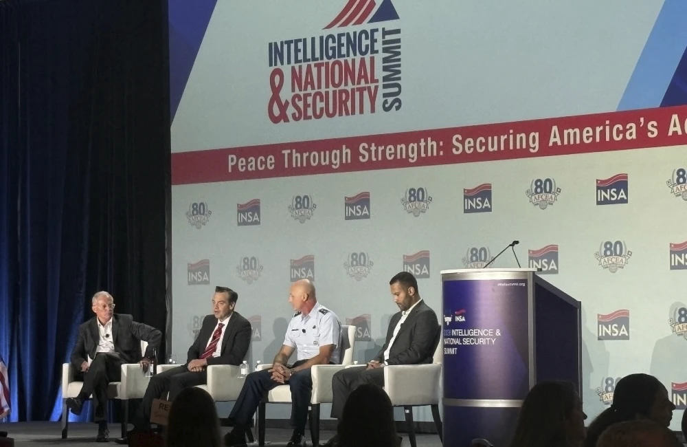 War Department CDAO Cameron Stanley, second from left, discusses how defense agencies are applying AI to national security alongside, from left, Lt. Gen. Bob Ashley Jr. (Retired), Maj. Gen. Robert Kinney of DIA and Capitol AI CEO Shaun Modi at the AFCEA/INSA Intelligence and National Security Summit on Aug. 27.