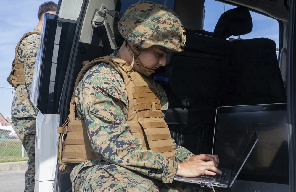 U.S. Marine Corps Lance Cpl. Jean Dortrait, a network administrator with Marine Aircraft Group 12, 1st Marine Aircraft Wing, troubleshoots the network performance in preparation for exercise Keen Sword 27 at Marine Corps Air Station Iwakuni, Yamaguchi, Japan, Oct. 15, 2026.